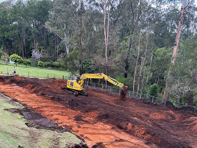 Large excavator digging up ground